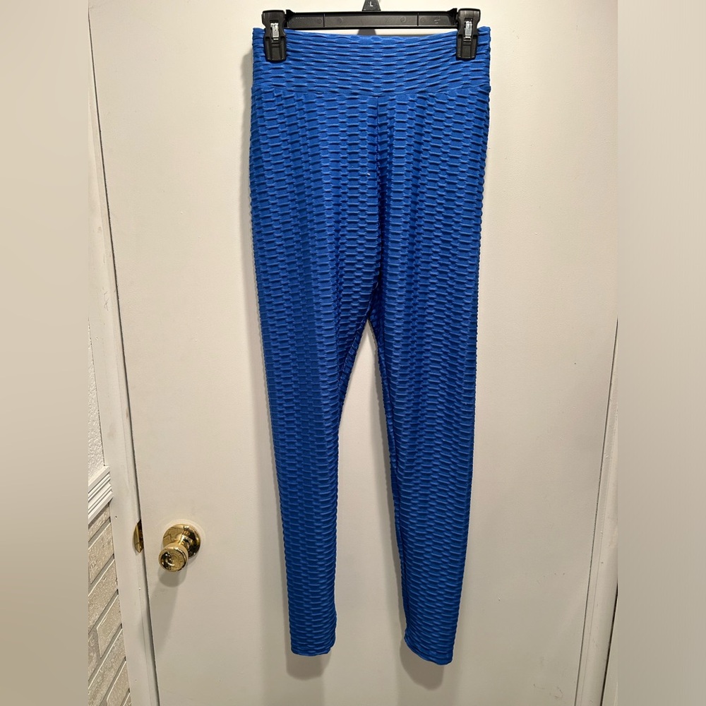 Medium blue leggings with cinching in the back